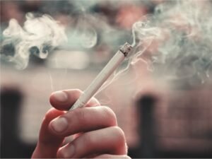 Hand holding a cigarette