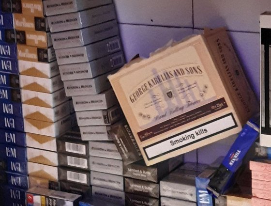 Cigarette packets and tobacco products