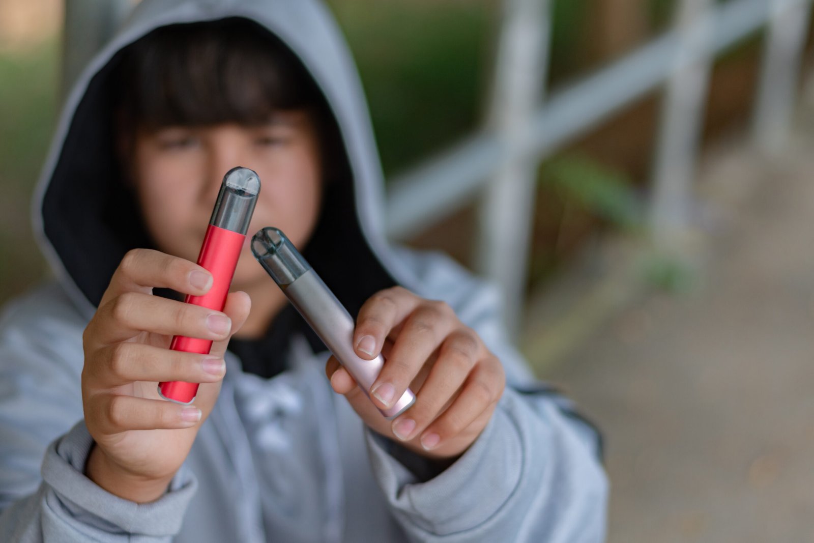 Child holding illegal vapes