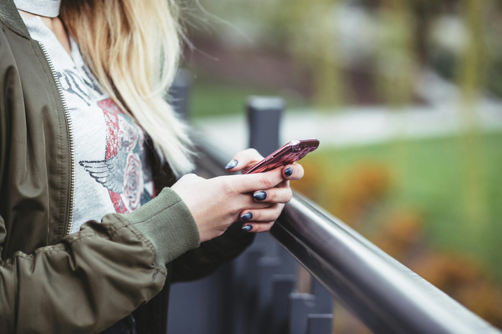 Teen holding a mobile phone