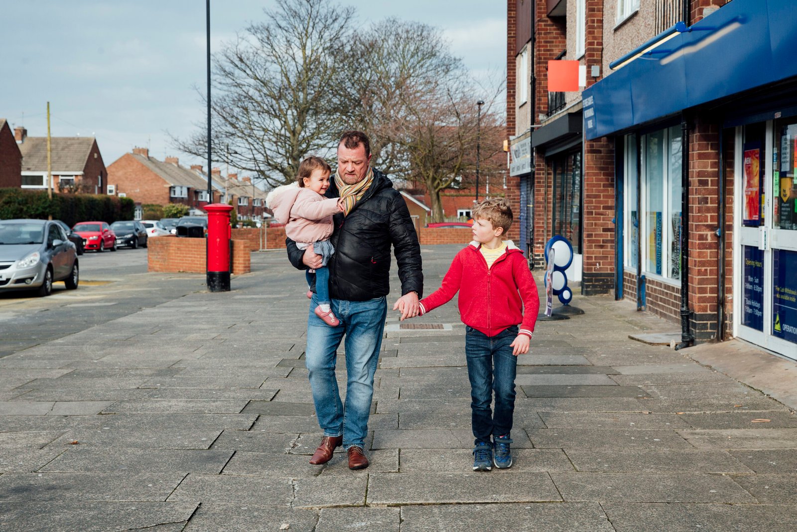 A family walking through a local high street